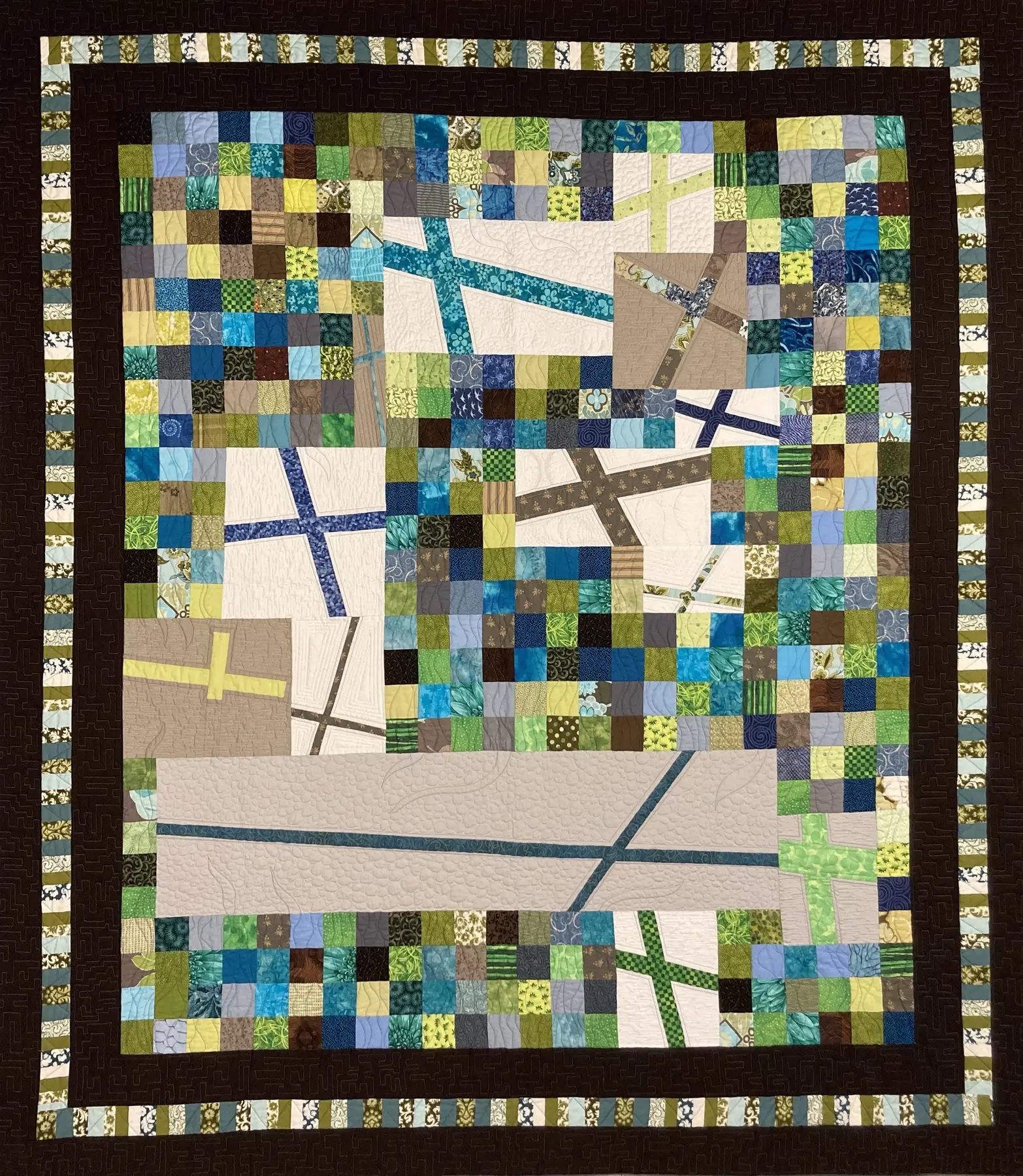 Art quilt with a pale blue and green grid crossed by an angular white bridge form